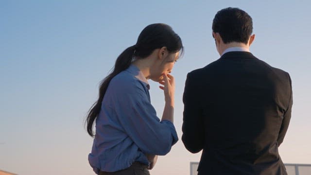 Two people having a conversation outdoors