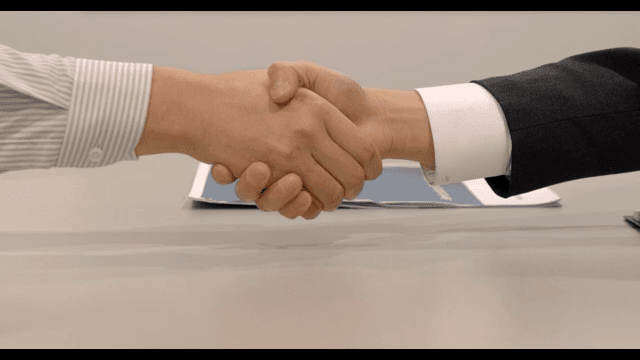 Contract Concluded with a Handshake of Businessmen
