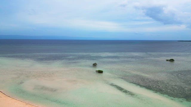 Tranquil sea with distant islands