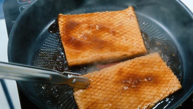 Pork Rind Sizzling in a Pan