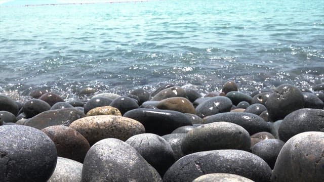 Serene Pebble Beach with Gentle Waves