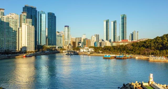 Morning to night view of the port with skyscrapers visible