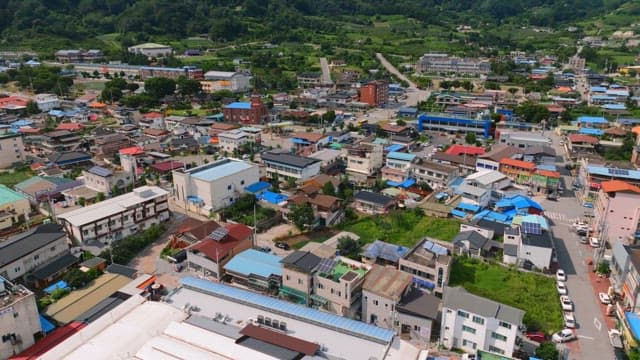 Colorful town surrounded by greenery