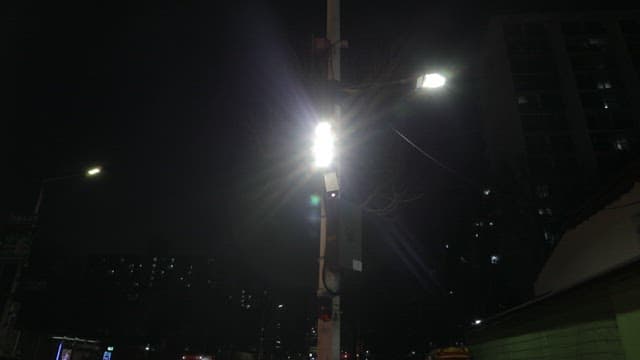 Dark Street at Night Illuminated by Streetlights