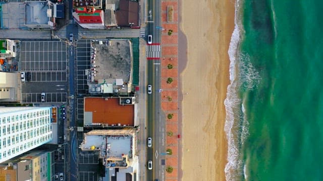 Aerial View of Coastal Road Next to Beach