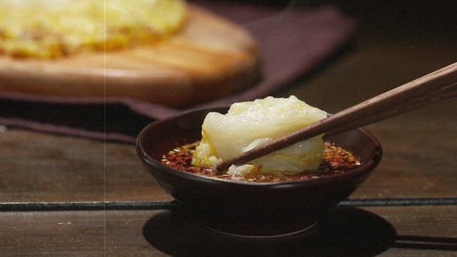 Warm cabbage pancakes dipped in soy sauce