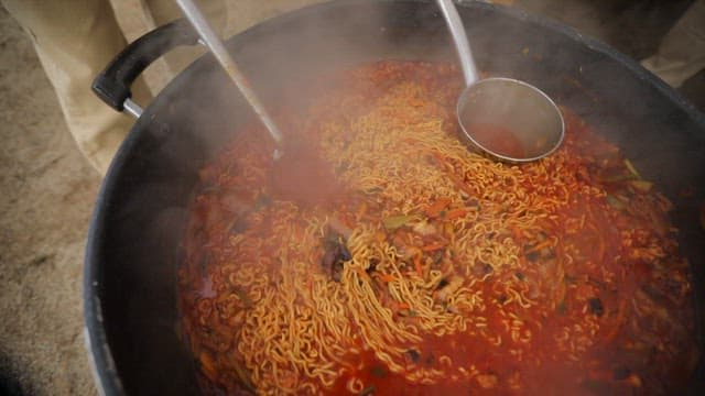 Large pot of spicy jjamppong ramen being cooked