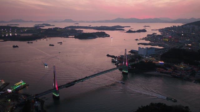 Sunset in Yeosu with a view of Dolsandaegyo Bridge over the sea