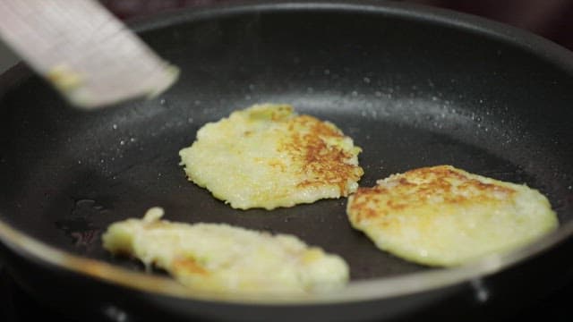 Cooking potato pancakes in a pan