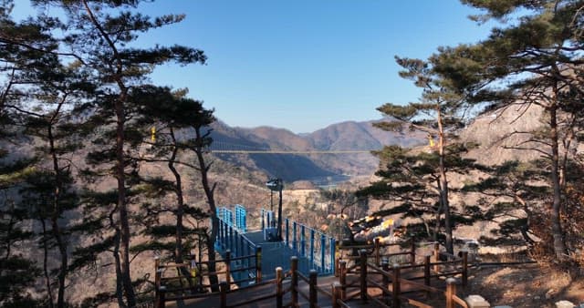 Scenic View of a Suspension Bridge across a Valley