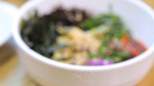 Korean bibimbap with fresh vegetables and abalone