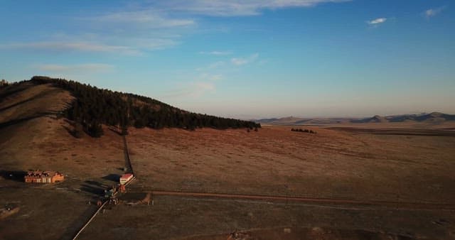 Vast landscape with mountains and fields