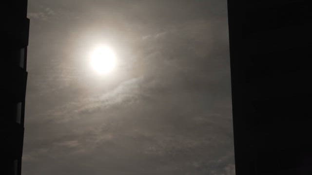 SunlightShining through the Clouds Seen through the Window