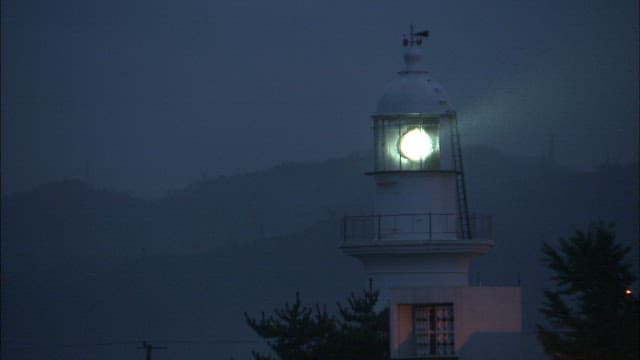 Illuminated Lighthouse at Dusk