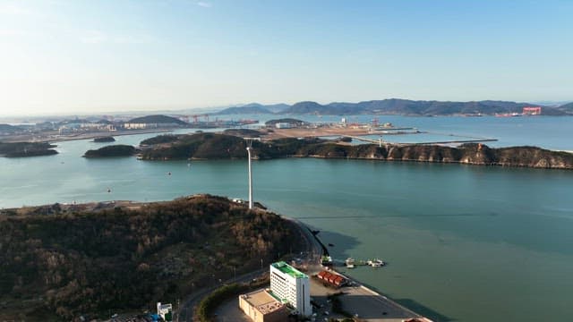 Coastal city with cable cars and mountains
