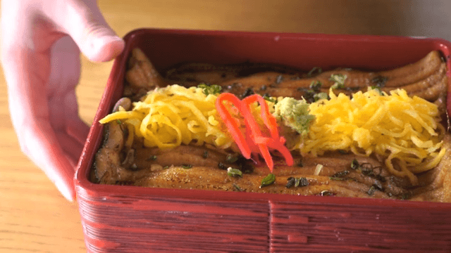 Close-up of Eel Dish Being Served