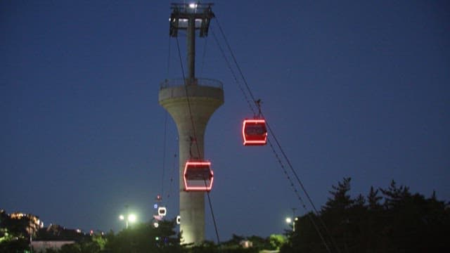 Night View of a City from a Cable Car