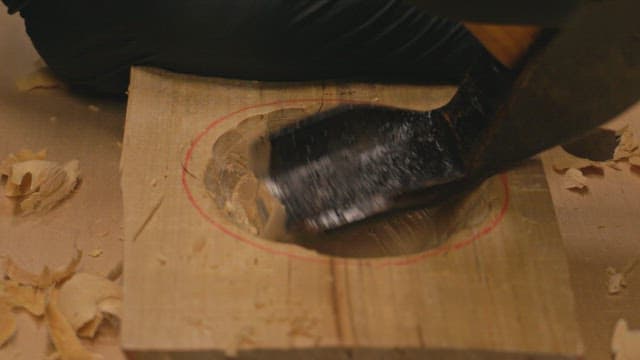 Wood carving with a chisel