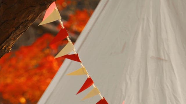 Autumn Leaves and Colorful Garland along Tents