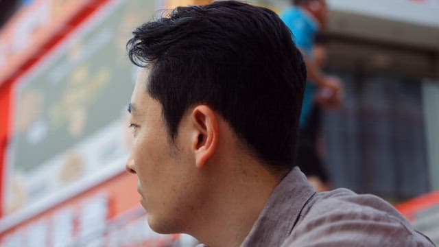 Man looking around on outdoor stairs