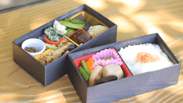 Bento Boxes on Wooden Table Outdoors