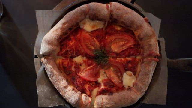 Freshly baked pizza served on a table