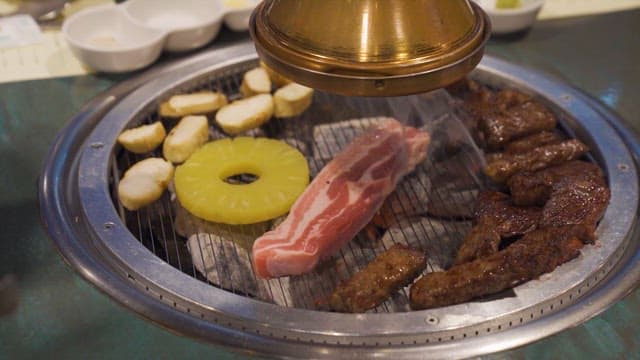 Meat and Pineapple Grilled on a Korean Barbecue Grill