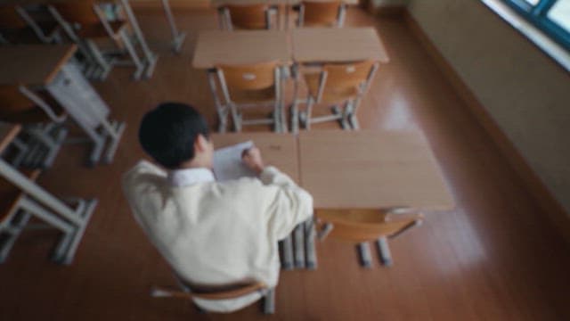 Student Studying Alone in the Classroom