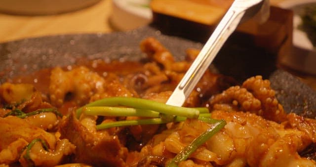 Spicy Stir-Fried Octopus Dish on Hot Pan