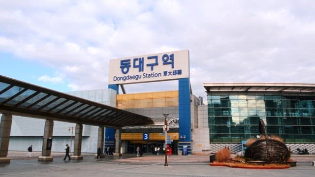 Passengers walking outside Dongdaegu Station