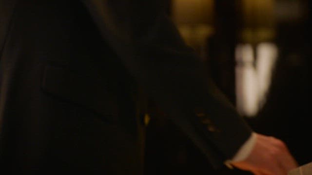 Man Wearing a Suit and Snapping His Fingers