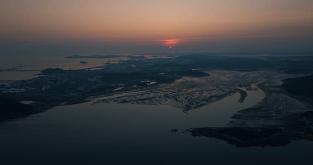Serene Twilight Coastal Landscape as the Sun Sets