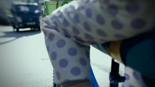 Child Riding Bicycle in Alley