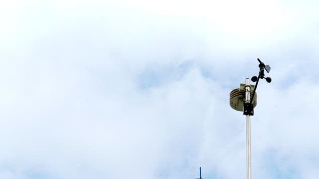 Anemometer measuring the speed, strength, and direction of the wind under the sky