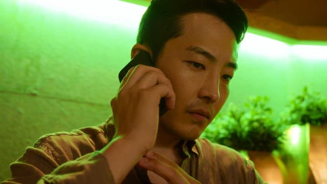 Man talking on the phone with a serious expression