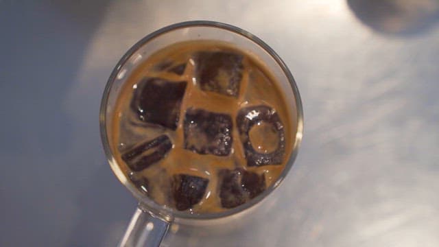 Ice Cubes in a Glass Topped with Milk Foam