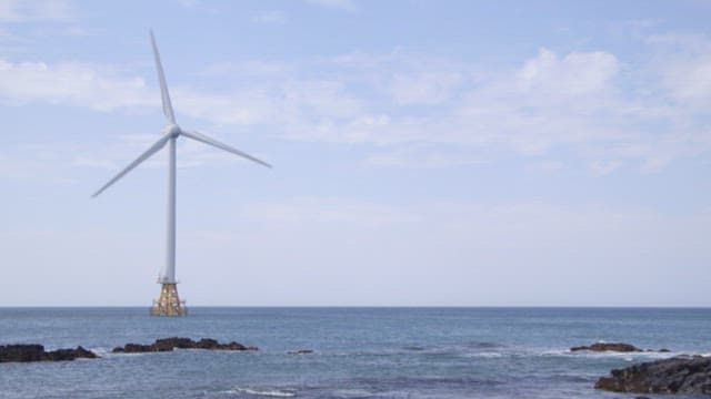 Offshore Wind Turbine Overlooking the Sea