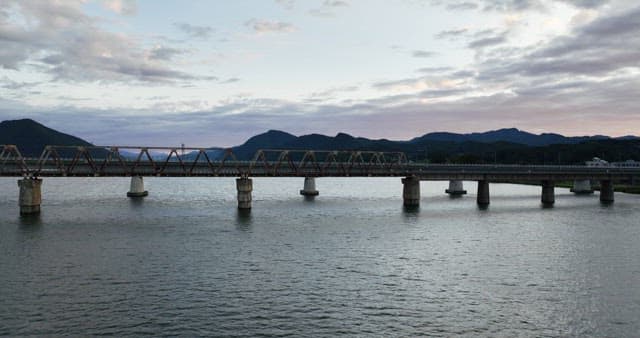 Bridge over a calm river at dusk