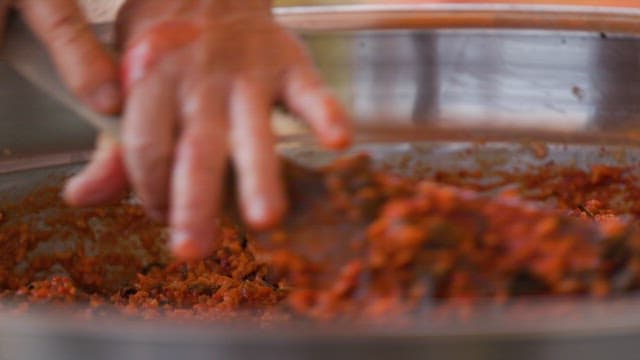 Soybean paste made by mixing ingredients in a large bowl
