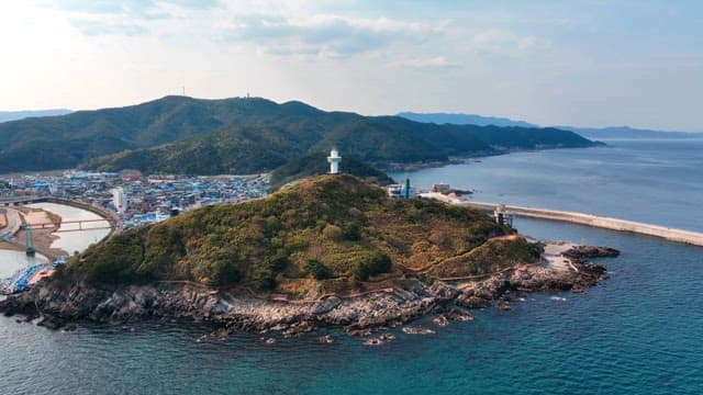 Coastal village with a lighthouse