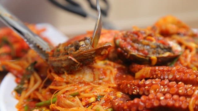 Spoonful of abalone from the spicy braised seafood