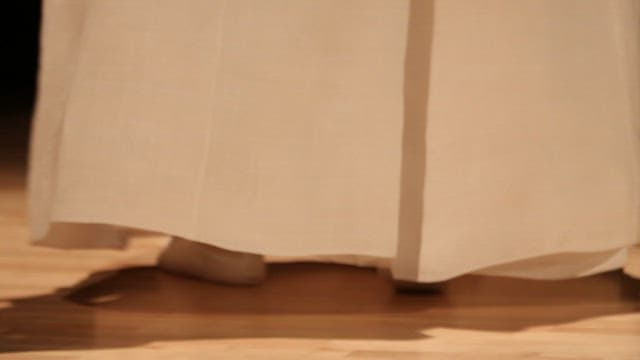 Person wearing hanbok dancing indoors