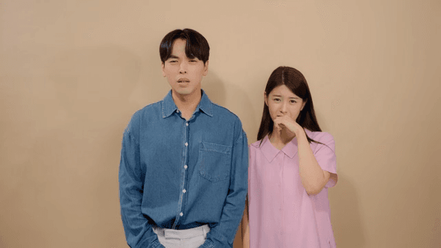 Man and a woman expressing their sadness by crying and wiping away tears