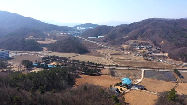 Rural Village with Mountains and Farmland