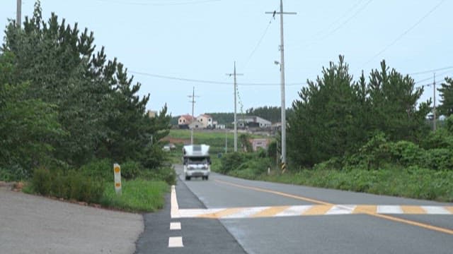 Camping Car Running on a Rural  Road on a Sunny Day