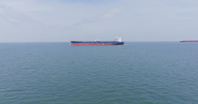 Large cargo ship sailing on the open sea