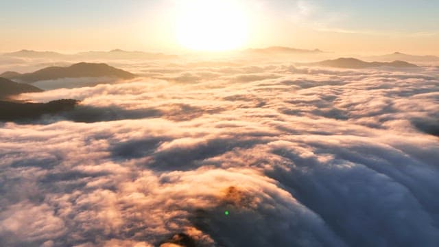 Sunrise over clouds and mountains