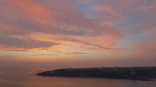 Serene coastal town at sunset