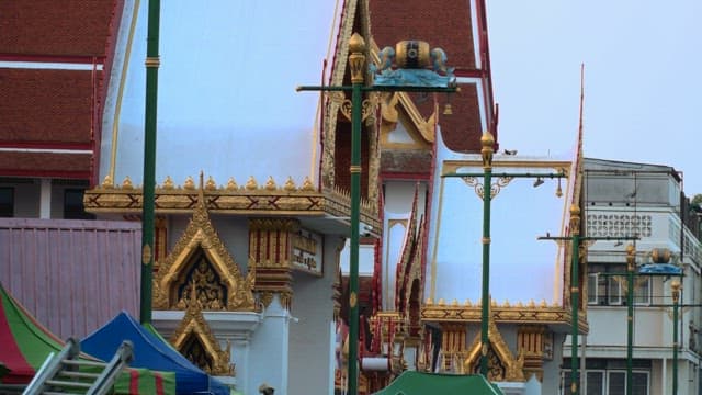 Thai Buddhist temple's exterior with decorative gold and white details