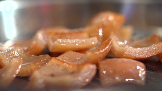 Pork rinds grilled over a grill